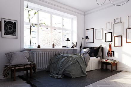 White and gray bedroom with full size bed.