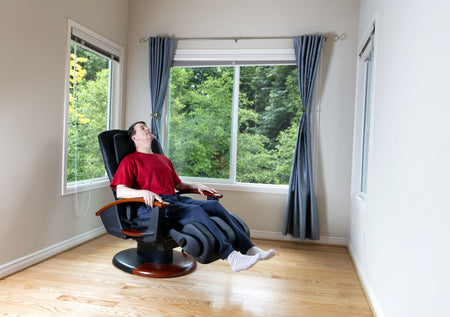 Man resting sitting in massage chair