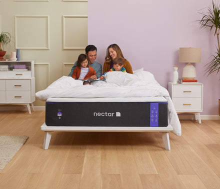 Family playing on a Nectar mattress.